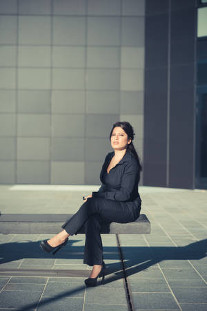 beautiful long black hair elegant business woman in the cityの写真素材