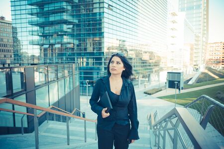 beautiful long black hair elegant business woman in the cityの写真素材