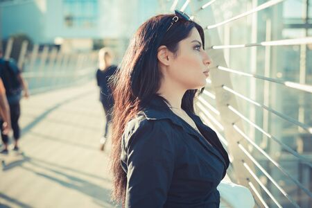 beautiful long black hair elegant business woman in the cityの写真素材