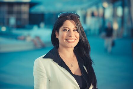 beautiful long black hair elegant business woman in the cityの写真素材