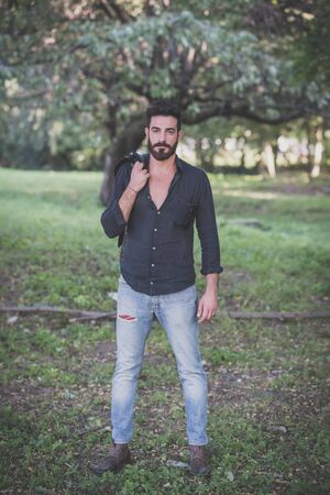 young handsome attractive bearded model man in the woodsの写真素材