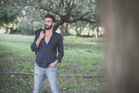 young handsome attractive bearded model man in the woodsの写真素材