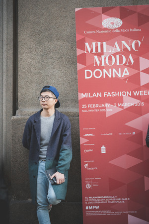 MILAN, ITALY - MARCH 01: People during Milan Fashion week, Italy on March, 01 2015. Eccentric and fashionable people outside city during Milan fashion week wait for models and famous peopleのeditorial素材