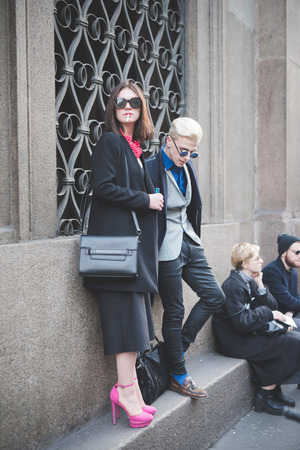 MILAN, ITALY - MARCH 01: People during Milan Fashion week, Italy on March, 01 2015. Eccentric and fashionable people outside city during Milan fashion week wait for models and famous peopleのeditorial素材