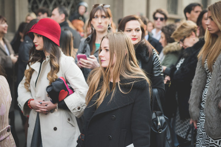 MILAN, ITALY - MARCH 01: People during Milan Fashion week, Italy on March, 01 2015. Eccentric and fashionable people outside city during Milan fashion week wait for models and famous peopleのeditorial素材
