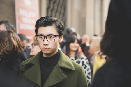 MILAN, ITALY - MARCH 01: People during Milan Fashion week, Italy on March, 01 2015. Eccentric and fashionable people outside city during Milan fashion week wait for models and famous peopleのeditorial素材
