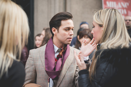 MILAN, ITALY - MARCH 01: People during Milan Fashion week, Italy on March, 01 2015. Eccentric and fashionable people outside city during Milan fashion week wait for models and famous peopleのeditorial素材