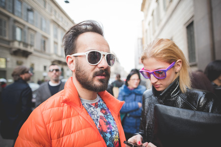 MILAN, ITALY - MARCH 01: People during Milan Fashion week, Italy on March, 01 2015. Eccentric and fashionable people outside city during Milan fashion week wait for models and famous peopleのeditorial素材