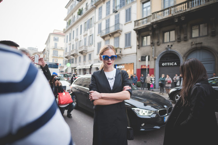 MILAN, ITALY - MARCH 01: People during Milan Fashion week, Italy on March, 01 2015. Eccentric and fashionable people outside city during Milan fashion week wait for models and famous peopleのeditorial素材