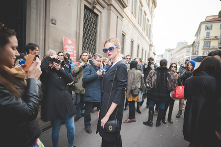 MILAN, ITALY - MARCH 01: People during Milan Fashion week, Italy on March, 01 2015. Eccentric and fashionable people outside city during Milan fashion week wait for models and famous peopleのeditorial素材