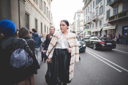 MILAN, ITALY - MARCH 01: People during Milan Fashion week, Italy on March, 01 2015. Eccentric and fashionable people outside city during Milan fashion week wait for models and famous peopleのeditorial素材