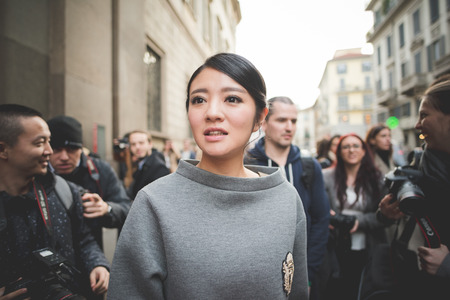 MILAN, ITALY - MARCH 01: People during Milan Fashion week, Italy on March, 01 2015. Eccentric and fashionable people outside city during Milan fashion week wait for models and famous peopleのeditorial素材