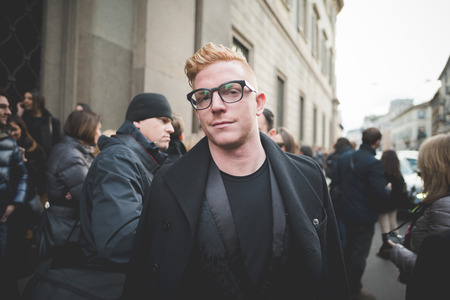 MILAN, ITALY - MARCH 01: People during Milan Fashion week, Italy on March, 01 2015. Eccentric and fashionable people outside city during Milan fashion week wait for models and famous peopleのeditorial素材