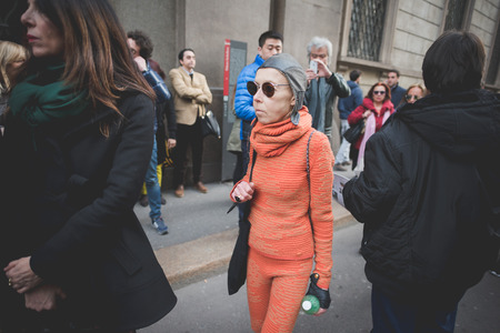 MILAN, ITALY - MARCH 01: People during Milan Fashion week, Italy on March, 01 2015. Eccentric and fashionable people outside city during Milan fashion week wait for models and famous peopleのeditorial素材