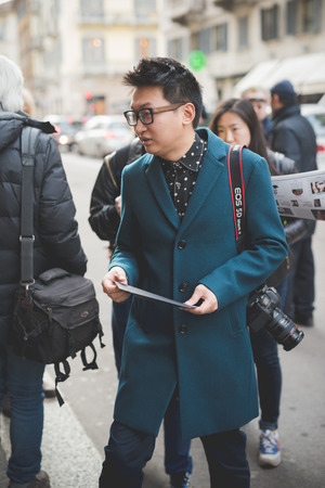 MILAN, ITALY - MARCH 01: People during Milan Fashion week, Italy on March, 01 2015. Eccentric and fashionable people outside city during Milan fashion week wait for models and famous peopleのeditorial素材