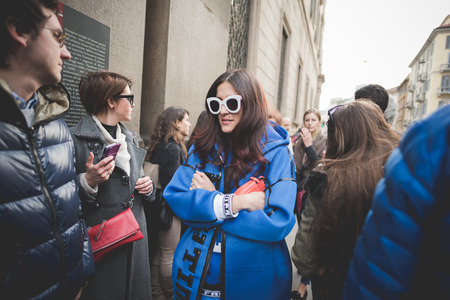 MILAN, ITALY - MARCH 01: People during Milan Fashion week, Italy on March, 01 2015. Eccentric and fashionable people outside city during Milan fashion week wait for models and famous peopleのeditorial素材