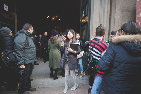 MILAN, ITALY - MARCH 01: People during Milan Fashion week, Italy on March, 01 2015. Eccentric and fashionable people outside city during Milan fashion week wait for models and famous peopleのeditorial素材