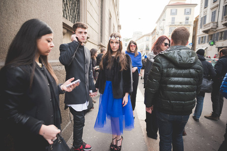 MILAN, ITALY - MARCH 01: People during Milan Fashion week, Italy on March, 01 2015. Eccentric and fashionable people outside city during Milan fashion week wait for models and famous peopleのeditorial素材