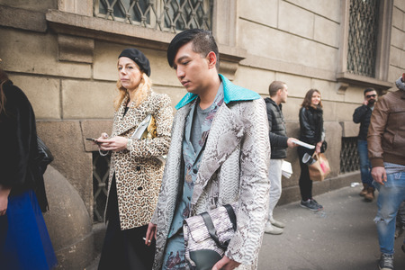 MILAN, ITALY - MARCH 01: People during Milan Fashion week, Italy on March, 01 2015. Eccentric and fashionable people outside city during Milan fashion week wait for models and famous peopleのeditorial素材