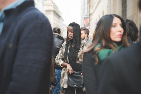 MILAN, ITALY - MARCH 01: People during Milan Fashion week, Italy on March, 01 2015. Eccentric and fashionable people outside city during Milan fashion week wait for models and famous peopleのeditorial素材