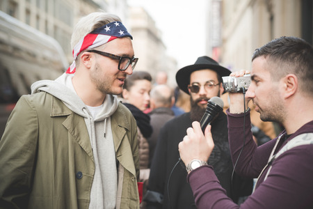 MILAN, ITALY - MARCH 01: People during Milan Fashion week, Italy on March, 01 2015. Eccentric and fashionable people outside city during Milan fashion week wait for models and famous peopleのeditorial素材
