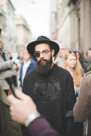 MILAN, ITALY - MARCH 01: People during Milan Fashion week, Italy on March, 01 2015. Eccentric and fashionable people outside city during Milan fashion week wait for models and famous peopleのeditorial素材