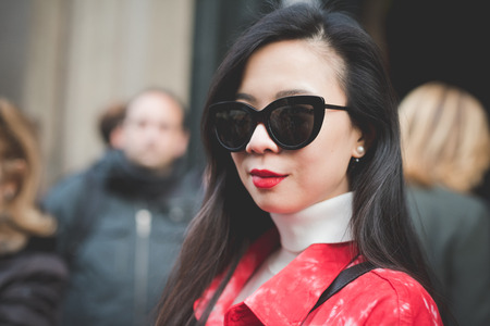 MILAN, ITALY - MARCH 01: People during Milan Fashion week, Italy on March, 01 2015. Eccentric and fashionable people outside city during Milan fashion week wait for models and famous peopleのeditorial素材