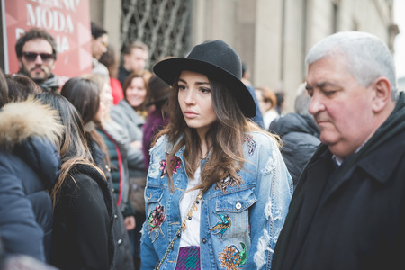 MILAN, ITALY - MARCH 01: People during Milan Fashion week, Italy on March, 01 2015. Eccentric and fashionable people outside city during Milan fashion week wait for models and famous peopleのeditorial素材