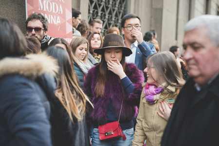 MILAN, ITALY - MARCH 01: People during Milan Fashion week, Italy on March, 01 2015. Eccentric and fashionable people outside city during Milan fashion week wait for models and famous peopleのeditorial素材