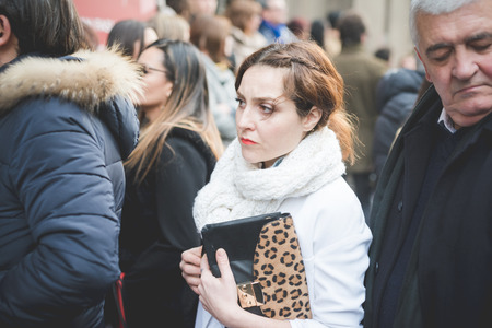 MILAN, ITALY - MARCH 01: People during Milan Fashion week, Italy on March, 01 2015. Eccentric and fashionable people outside city during Milan fashion week wait for models and famous peopleのeditorial素材
