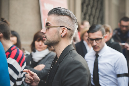 MILAN, ITALY - MARCH 01: People during Milan Fashion week, Italy on March, 01 2015. Eccentric and fashionable people outside city during Milan fashion week wait for models and famous peopleのeditorial素材