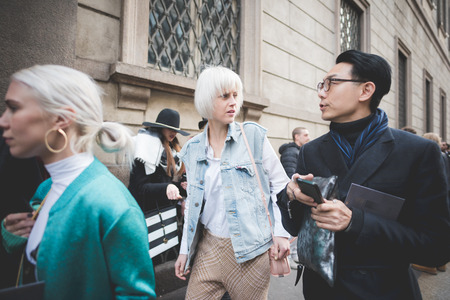 MILAN, ITALY - MARCH 01: People during Milan Fashion week, Italy on March, 01 2015. Eccentric and fashionable people outside city during Milan fashion week wait for models and famous peopleのeditorial素材