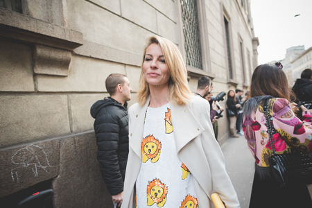 MILAN, ITALY - MARCH 01: People during Milan Fashion week, Italy on March, 01 2015. Eccentric and fashionable people outside city during Milan fashion week wait for models and famous peopleのeditorial素材