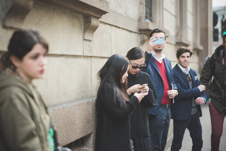 MILAN, ITALY - MARCH 01: People during Milan Fashion week, Italy on March, 01 2015. Eccentric and fashionable people outside city during Milan fashion week wait for models and famous peopleのeditorial素材