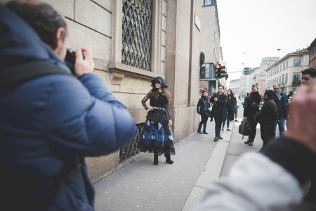 MILAN, ITALY - MARCH 01: People during Milan Fashion week, Italy on March, 01 2015. Eccentric and fashionable people outside city during Milan fashion week wait for models and famous peopleのeditorial素材