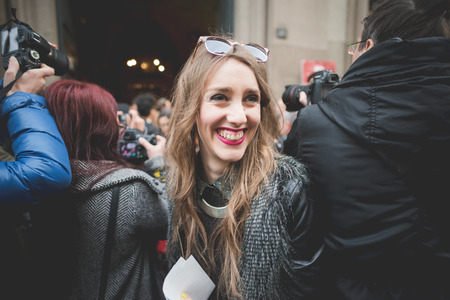 MILAN, ITALY - MARCH 01: People during Milan Fashion week, Italy on March, 01 2015. Eccentric and fashionable people outside city during Milan fashion week wait for models and famous peopleのeditorial素材