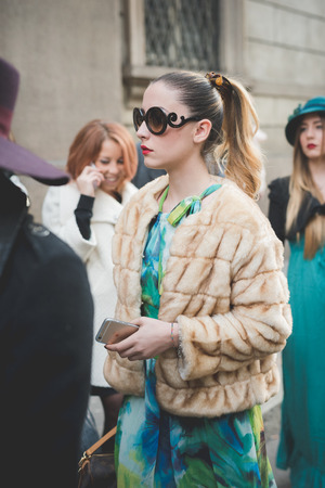 MILAN, ITALY - MARCH 01: People during Milan Fashion week, Italy on March, 01 2015. Eccentric and fashionable people outside city during Milan fashion week wait for models and famous peopleのeditorial素材