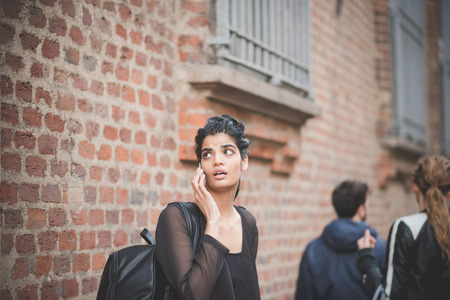 MILAN, ITALY - MARCH 01: People during Milan Fashion week, Italy on March, 01 2015. Eccentric and fashionable people outside city during Milan fashion week wait for models and famous peopleのeditorial素材