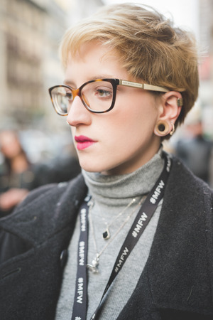 MILAN, ITALY - MARCH 01: People during Milan Fashion week, Italy on March, 01 2015. Eccentric and fashionable people outside city during Milan fashion week wait for models and famous peopleのeditorial素材