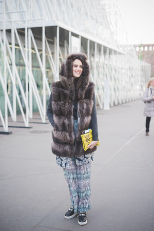 MILAN, ITALY - FEBRUARY 28: People during Milan Fashion week, Italy on February, 28 2015. Eccentric and fashionable people outside city during Milan fashion week wait for models and famous peopleのeditorial素材