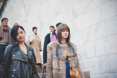 MILAN, ITALY - FEBRUARY 28: People during Milan Fashion week, Italy on February, 28 2015. Eccentric and fashionable people outside city during Milan fashion week wait for models and famous peopleのeditorial素材