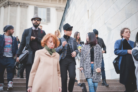 MILAN, ITALY - FEBRUARY 28: People during Milan Fashion week, Italy on February, 28 2015. Eccentric and fashionable people outside city during Milan fashion week wait for models and famous peopleのeditorial素材