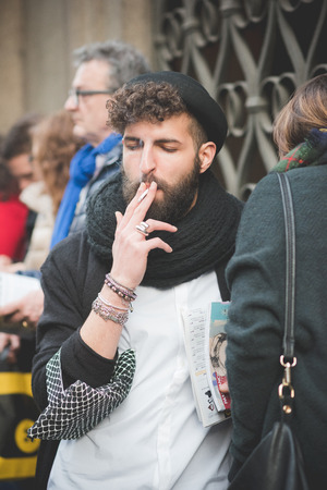 MILAN, ITALY - MARCH 01: People during Milan Fashion week, Italy on March, 01 2015. Eccentric and fashionable people outside city during Milan fashion week wait for models and famous peopleのeditorial素材