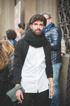 MILAN, ITALY - MARCH 01: People during Milan Fashion week, Italy on March, 01 2015. Eccentric and fashionable people outside city during Milan fashion week wait for models and famous peopleのeditorial素材