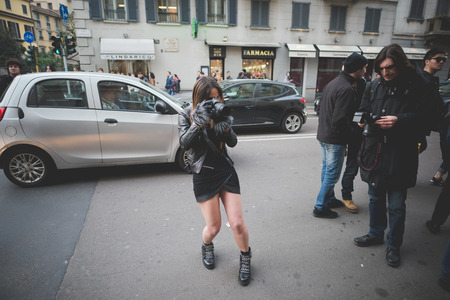 MILAN, ITALY - MARCH 01: People during Milan Fashion week, Italy on March, 01 2015. Eccentric and fashionable people outside city during Milan fashion week wait for models and famous peopleのeditorial素材