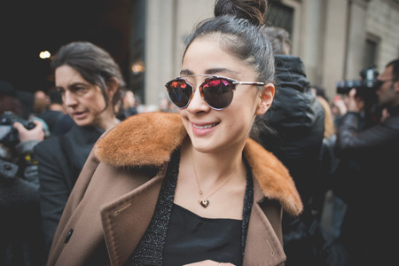 MILAN, ITALY - MARCH 01: People during Milan Fashion week, Italy on March, 01 2015. Eccentric and fashionable people outside city during Milan fashion week wait for models and famous peopleのeditorial素材