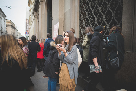 MILAN, ITALY - MARCH 01: People during Milan Fashion week, Italy on March, 01 2015. Eccentric and fashionable people outside city during Milan fashion week wait for models and famous peopleのeditorial素材
