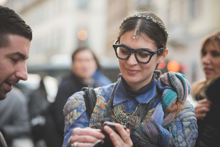 MILAN, ITALY - MARCH 01: People during Milan Fashion week, Italy on March, 01 2015. Eccentric and fashionable people outside city during Milan fashion week wait for models and famous peopleのeditorial素材