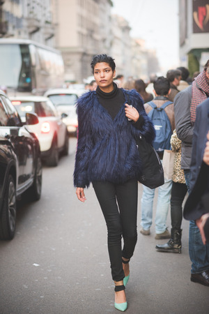 MILAN, ITALY - MARCH 01: People during Milan Fashion week, Italy on March, 01 2015. Eccentric and fashionable people outside city during Milan fashion week wait for models and famous peopleのeditorial素材
