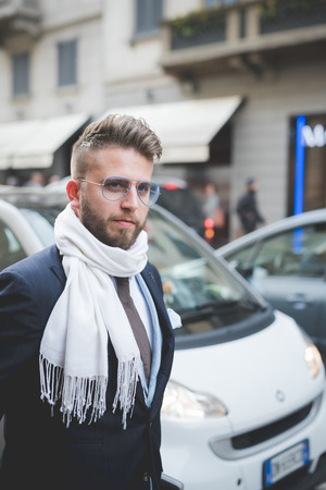MILAN, ITALY - MARCH 01: People during Milan Fashion week, Italy on March, 01 2015. Eccentric and fashionable people outside city during Milan fashion week wait for models and famous peopleのeditorial素材